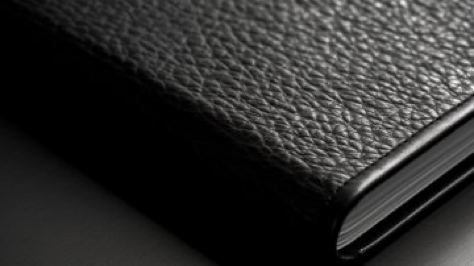 macro product photography of a black notebook --ar 16:9 --style raw --v 5.1