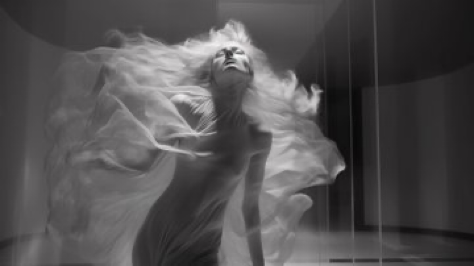 Inverted world by Iris van Herpen, stylish lady dancing, sad facial expression, extra wide shot, slow shutter speed, film still